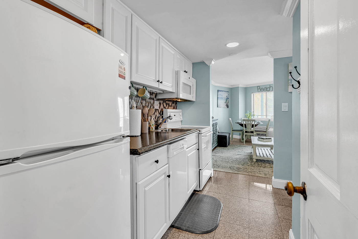 Brasilliance team member cleaning a beautifully appointed coastal home